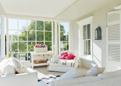 sunroom with white furniture